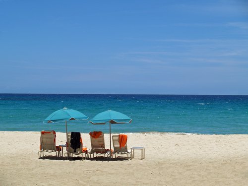 Beach umbrellas and chairs in