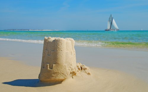 Sand Castle on the Beach in beach sand castle. Sand Castle on the Beach in