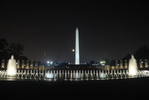 World War II memorial and the Washington Monument at night.