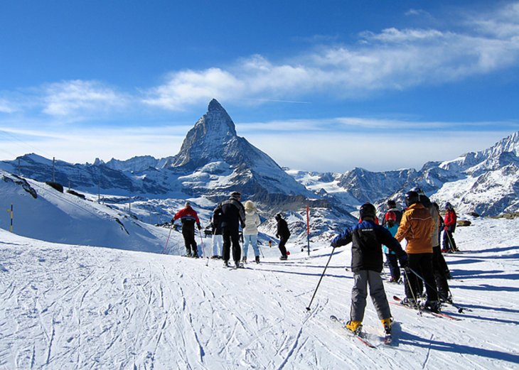 Skiers in front of the Matterhorn