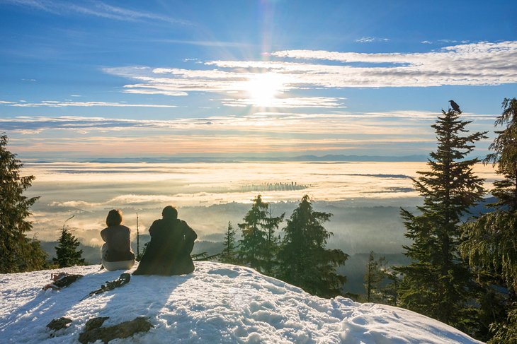 Hikers enjoying the stunning view from the top of Dog Mountain