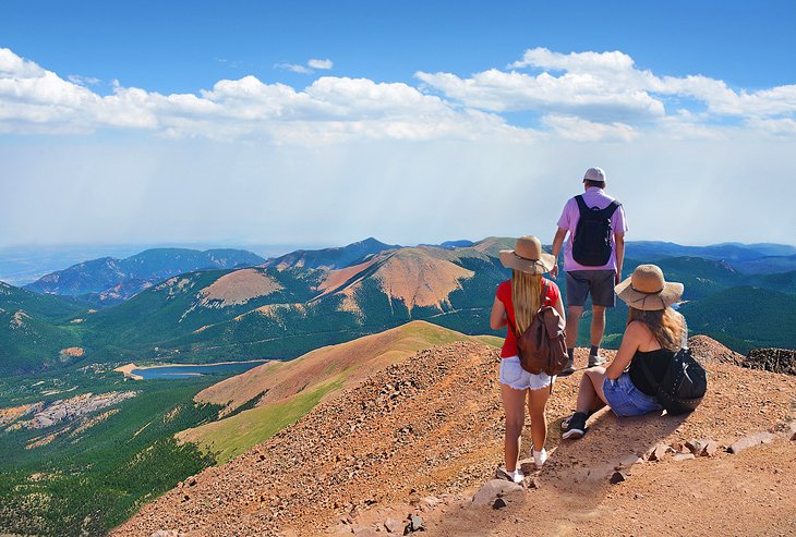 Hikers enjoying the view from the summit of Pikes Peak