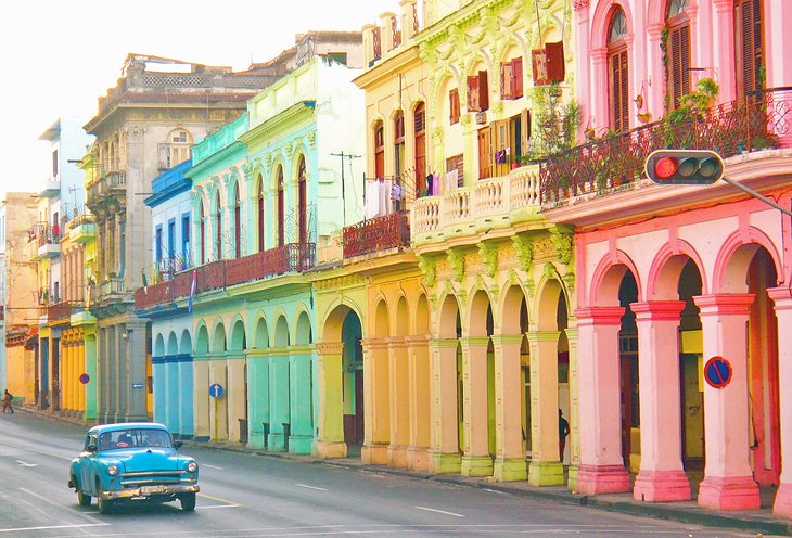 Colorful buildings and a classic car in Old Havana
