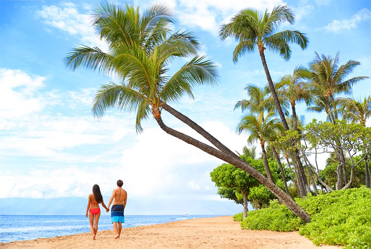 Couple enjoying a stroll on Kaanapali Beach, Maui