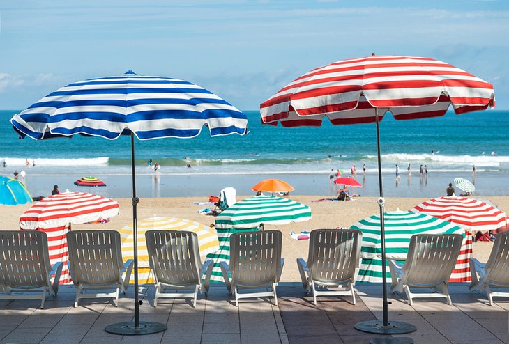 Striped umbrellas on the beach in Biarritz