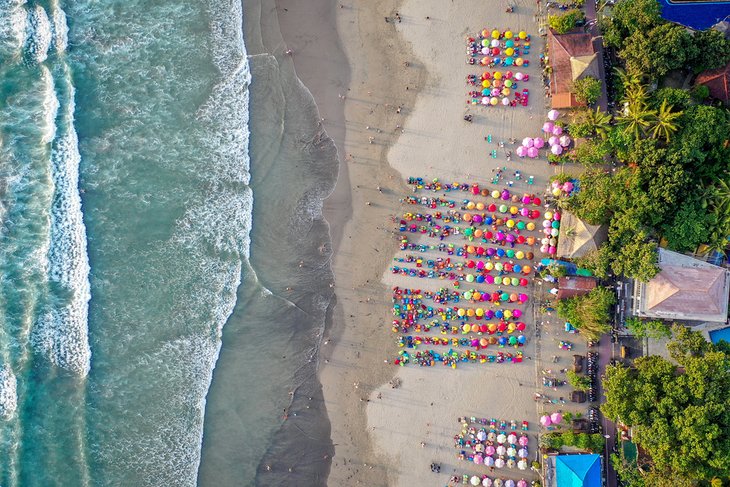 Aerial view of colorful umbrellas on Seminyak Beach