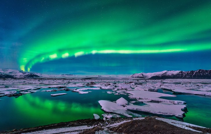 Aurora borealis lights up the sky above the Jokulsarlon Glacial Lagoon
