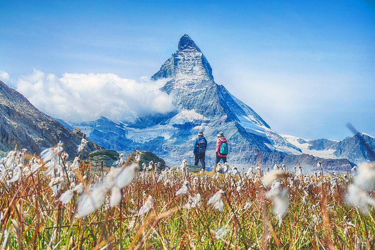 Couple hiking in front of the Matterhorn
