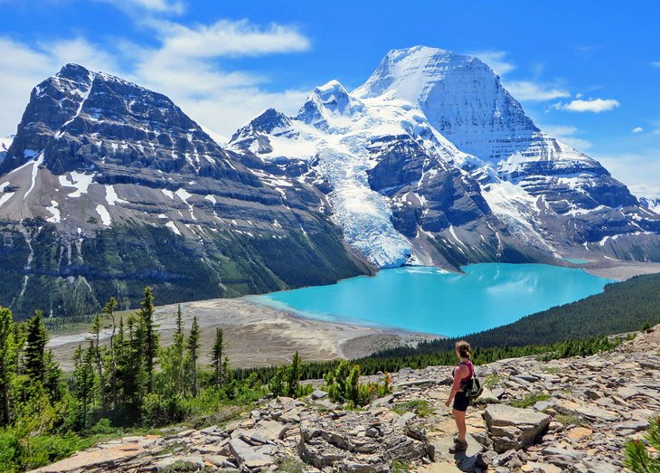 Hiker admiring Berg Lake, Berg Glacier, and Mount Robson