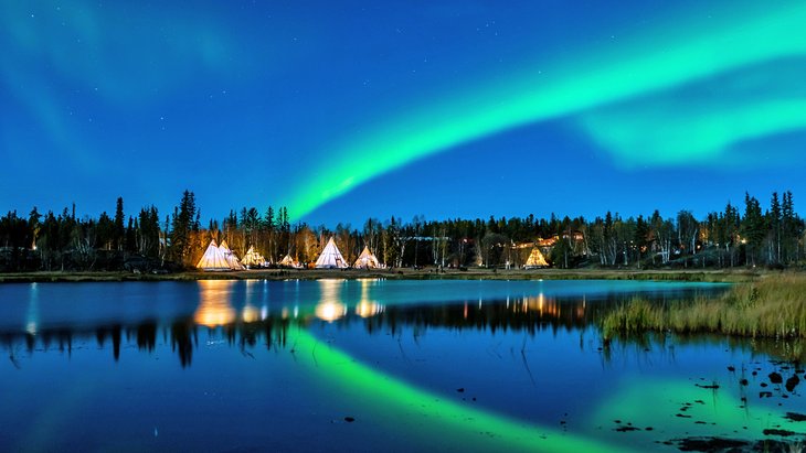 The northern lights over teepees at Yellowknife, Northwest Territories