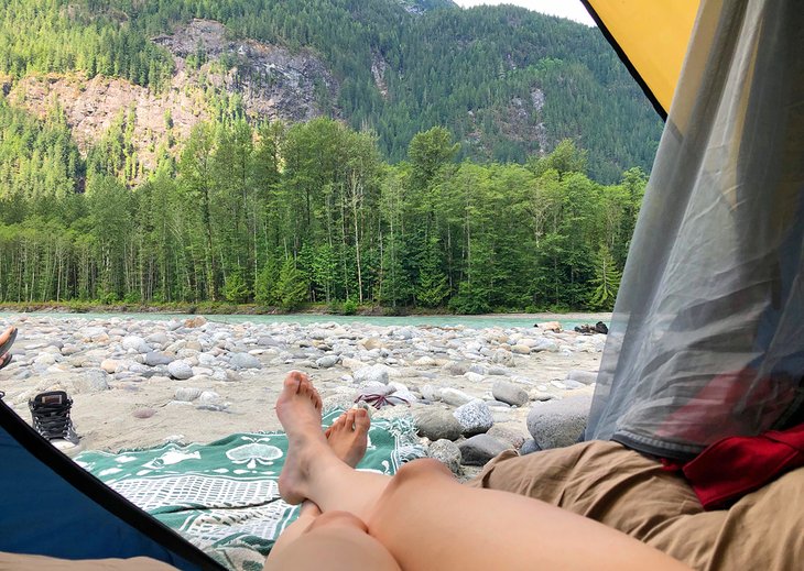 Campers enjoying the view from their tent at the Squamish Valley Campground