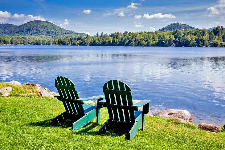 Adirondack chairs on the shore of Mirror Lake, Lake Placid