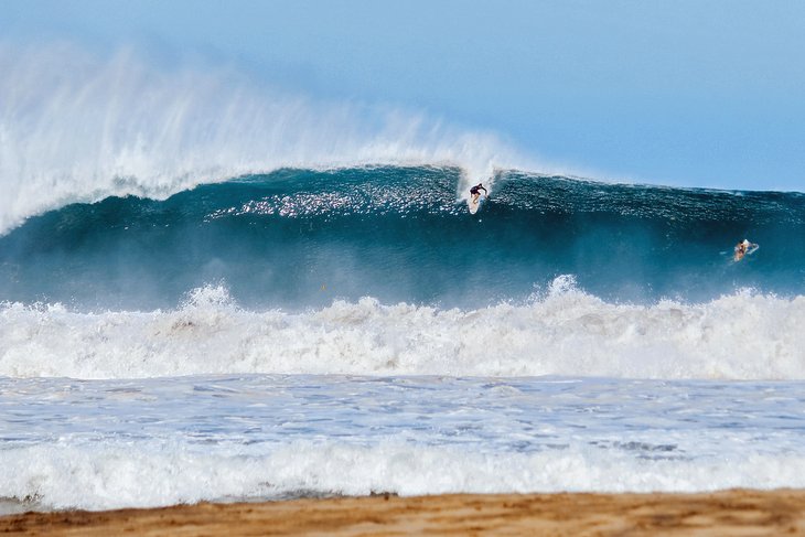 Surfer taking off on a big Puerto Escondido wave