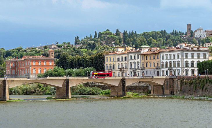 Tour bus crossing the River Arno in Florence