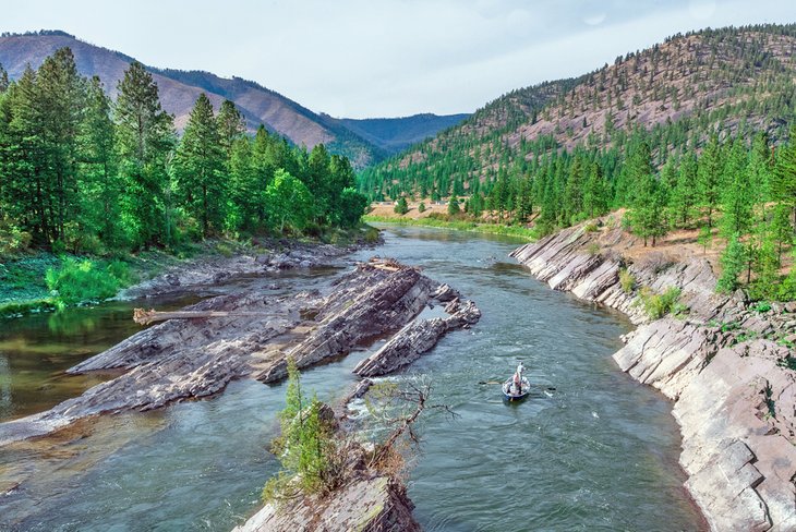 Drift boat fly fishing through the Alberton River Gorge on the Clark Fork River