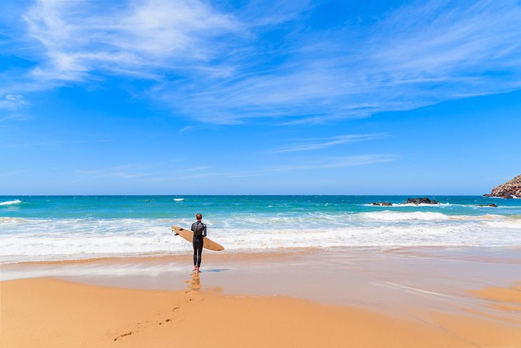 Surfer checking the waves at Praia do Amado
