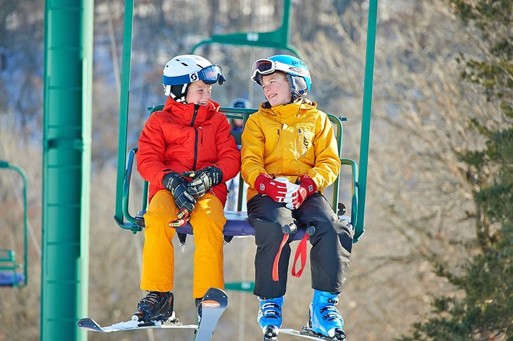 Kids enjoying the chairlift ride at Afton Alps Resort