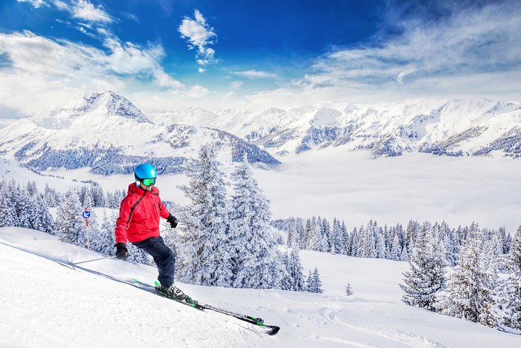 Skier enjoying fresh powder in Kitzbühel