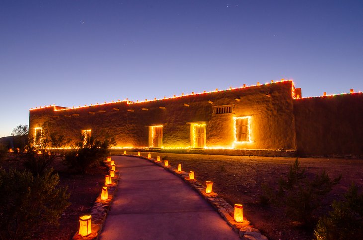 Luminarias light up Fort Leaton in December.