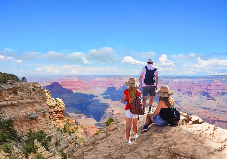 Family enjoying the view on the rim of the Grand Canyon