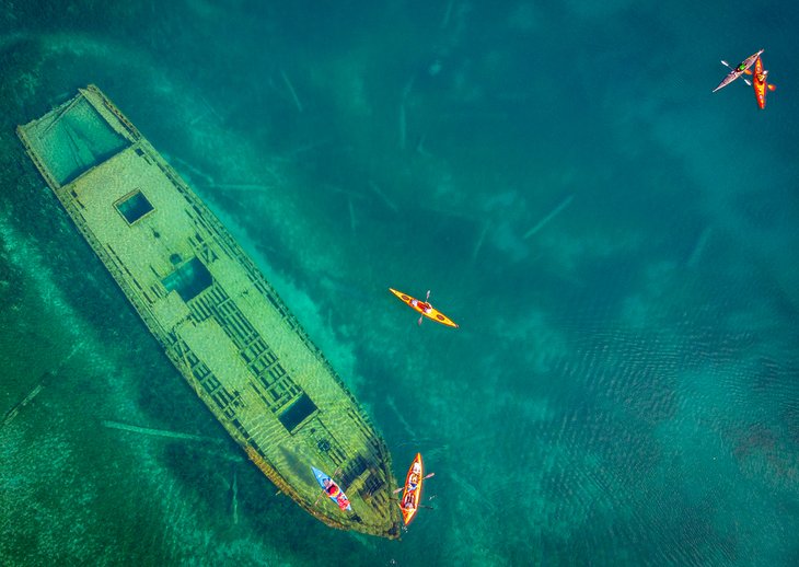 Aerial view of kayakers above a shipwreck at Fathom Five National Park