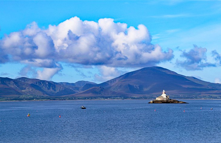 Fenit Lighthouse with the mountains of the Dingle Peninsula