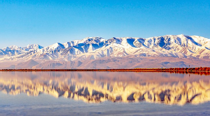 Snow-covered mountains reflected in the Great Salt Lake