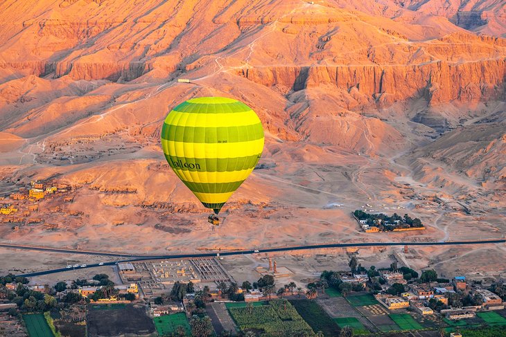 Balloon over the Valley of Kings at dawn in Luxor, Egypt