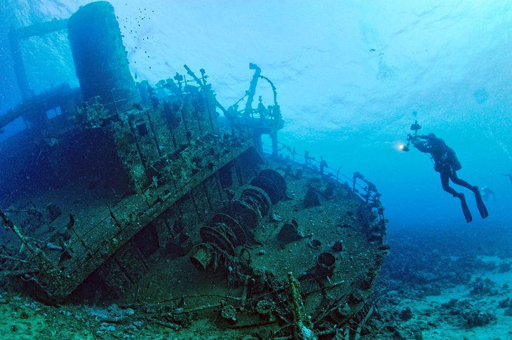 Diver photographing a wreck in Abu Nuhas