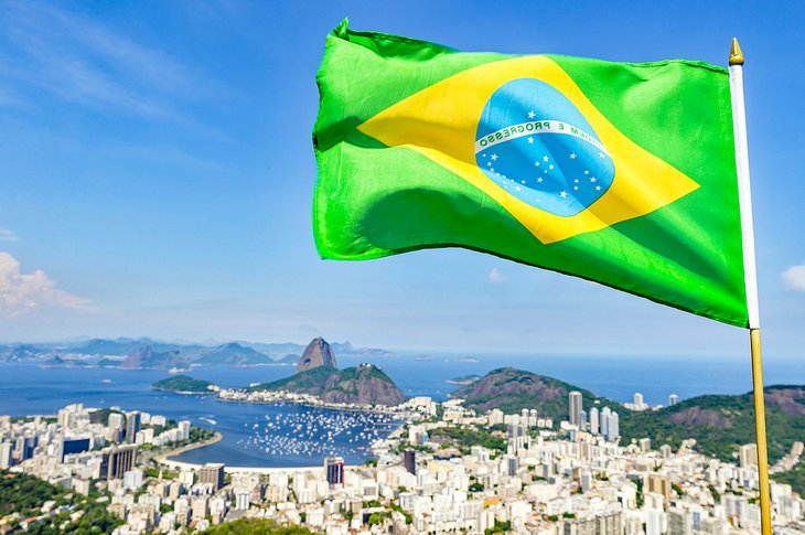 Brazilian flag flying above Rio de Janeiro