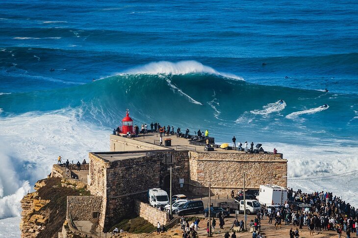 Surfer on a huge wave at Nazare