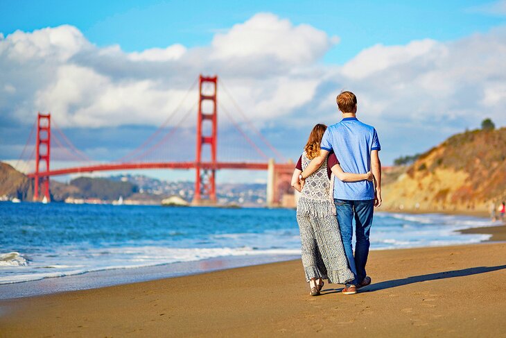 Enjoying a beach walk by the Golden Gate Bridge in San Francisco