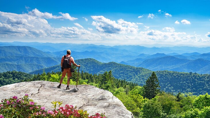 Hiker enjoying the view over the Smoky Mountains from the Blue Ridge Parkway in North Carolina