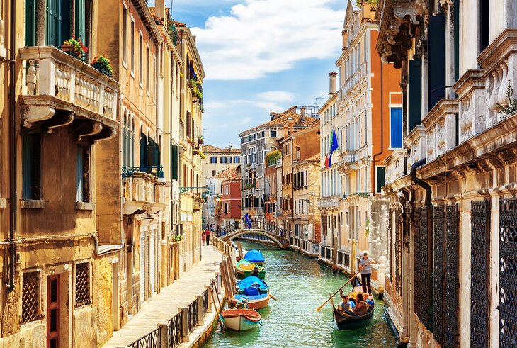 Boats and a gondola on the Rio Marin Canal in Venice