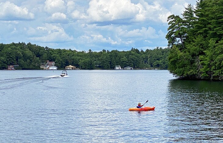A boat and kayak on Lake Rosseau
