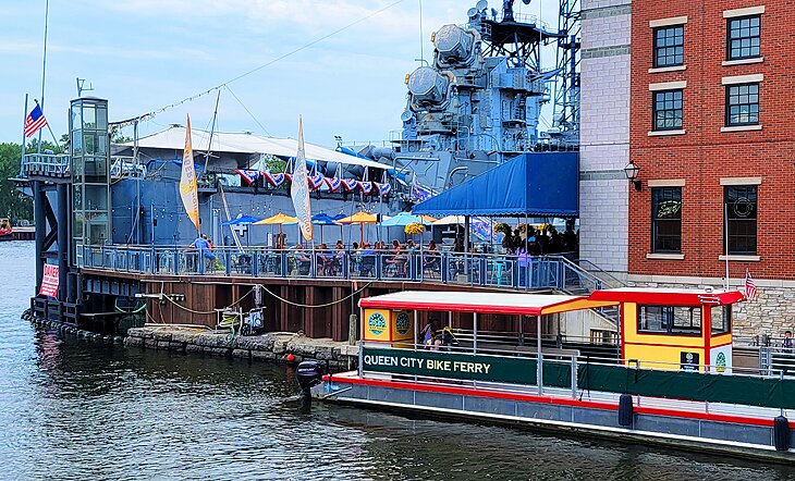 Queen City Bike Ferry and a restaurant in Canalside