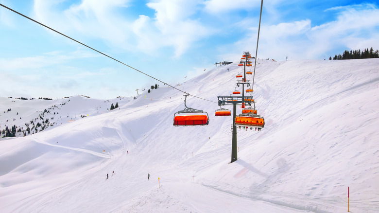 Orange ski lift and ski slope in Saalbach resort, Austria, Alps,