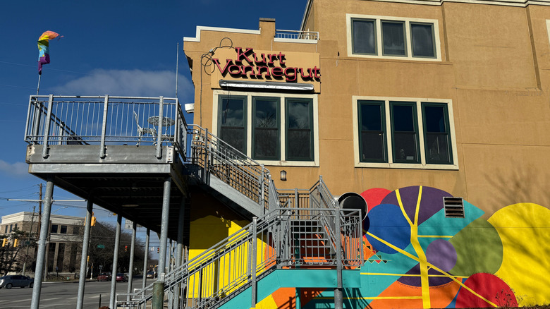 Exterior view of signage and a bright mural on the Kurt Vonnegut Museum and Library in Indianapolis, Indiana