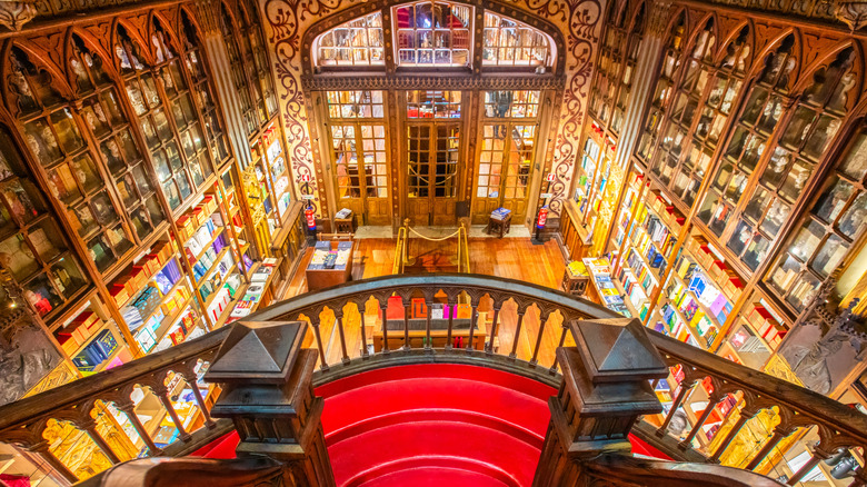 Golden interior of the Livraria Lello and its famous central staircase in Porto, Portugal