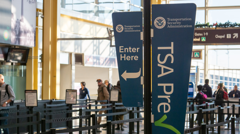 Signage for TSA PreCheck line heading into security at Reagan National Airport in Washington DC