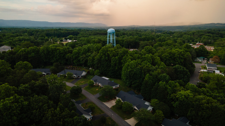 Aerial view of the sunset over a water tower in Mount Airy, North Carolina in the summer.