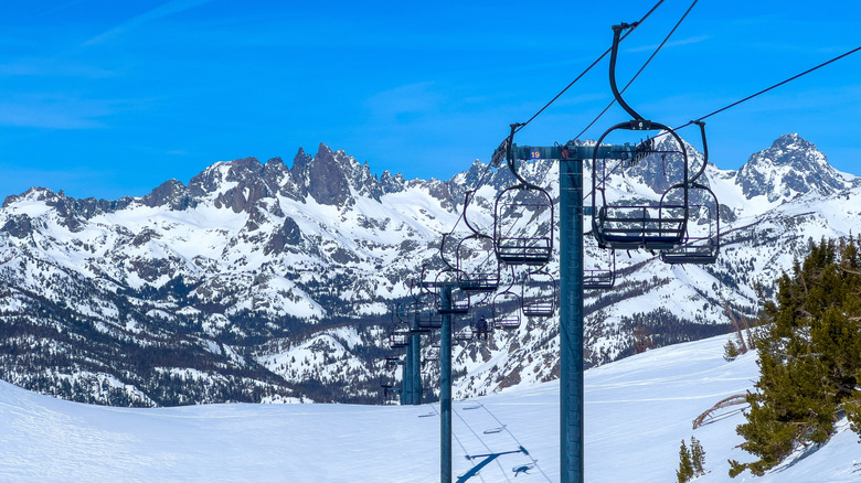 View of Chair 14 and the snowy Minarets on Mammoth Mountain on a bright, sunny day