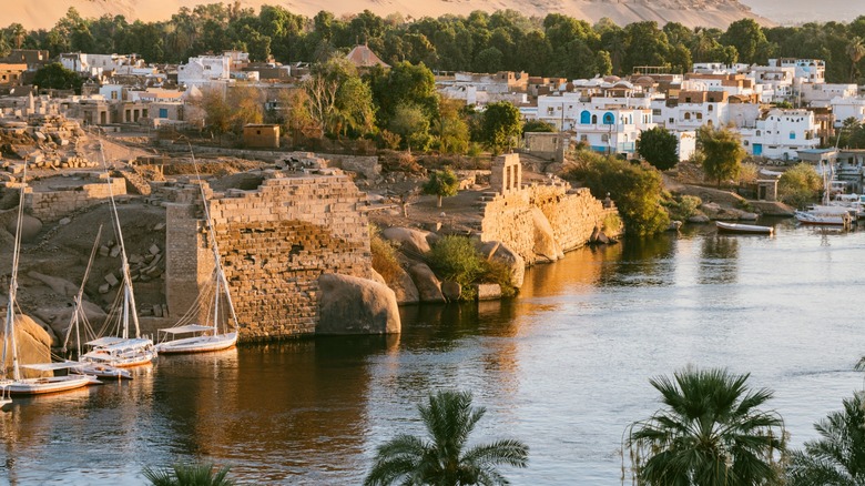 Aswan cityscape along the Nile River at sunset