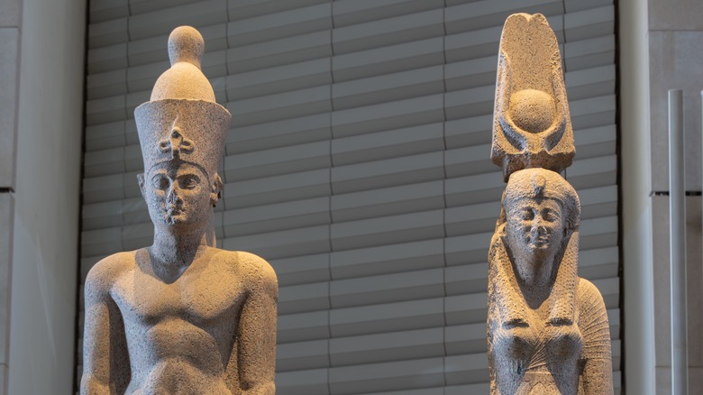 Ancient statues of Ptolemaic royalty in Grand Egyptian Museum