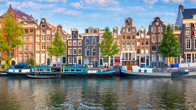 Houses and houseboats along a canal in Amsterdam