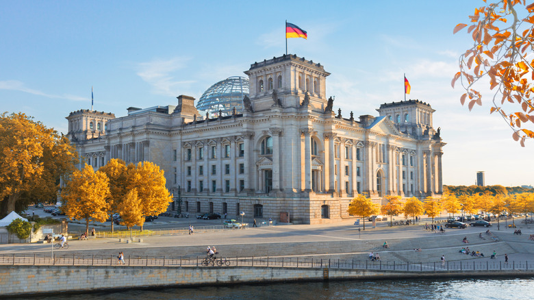 The Reichstag Building surrounded by fall trees