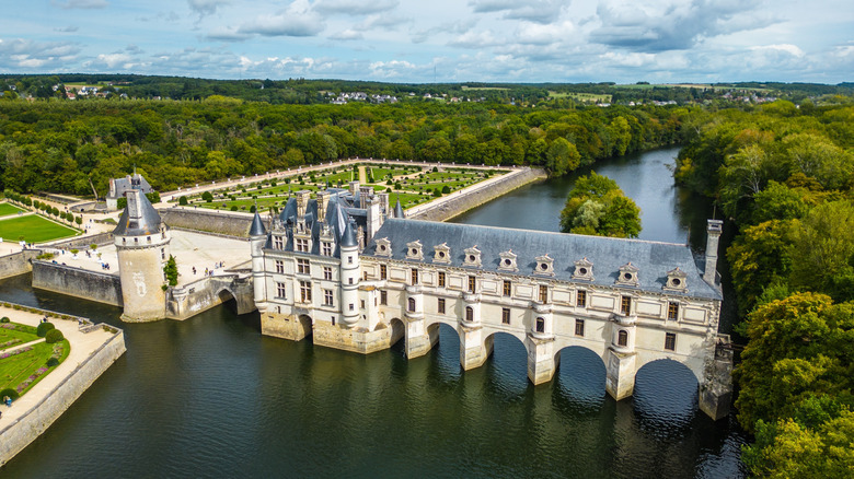 Aerial view of Château de Chenonceau, on the River Cher, surrounded by lush forests