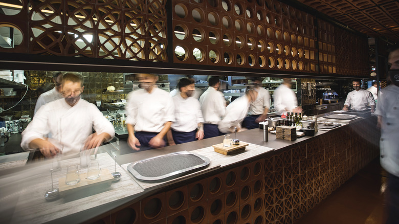 Chefs working in the kitchen at Disfrutar