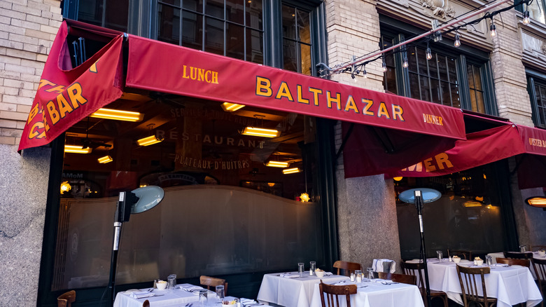 Exterior of Balthazar red awning