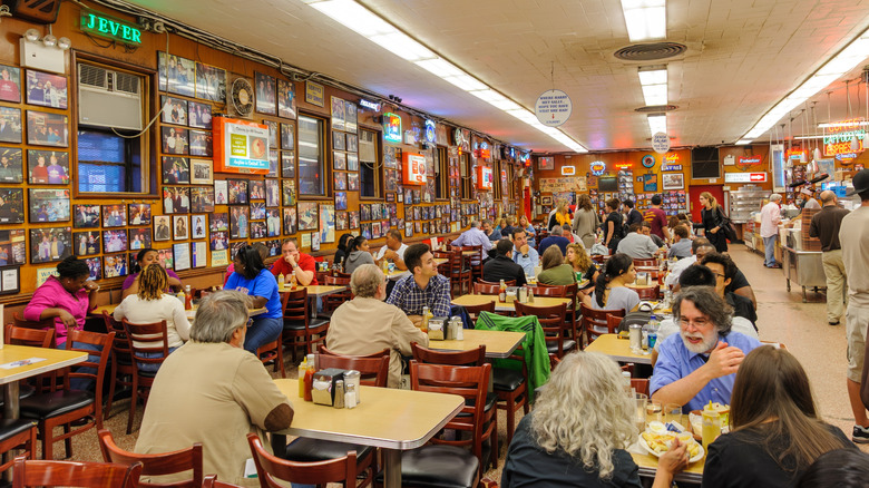 People eating inside Katz's Delicatessen